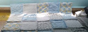 Soft baby blue rag quilt.