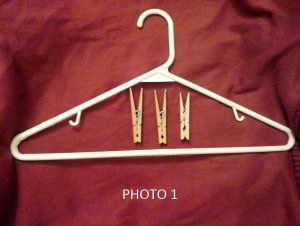 All you need are clothes hangers, clothespins, and a marker or pen (not pictured).