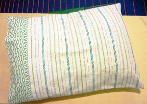A classic pillowcase for bedding closes 1 of 2 ways.