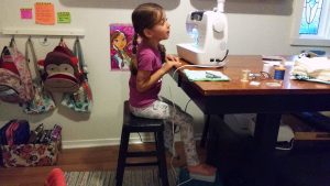 When my 6 year old daughter sews with me, I place the foot pedal on a bathroom stool so that she can reach it while she sews.