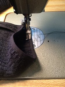 If you need to sew a small circumference like a sleeve hem, turn it the opposite way out you would if you were using a free arm.