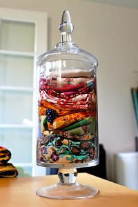 The most fitting right now is the notion of keeping excess fabric pieces in a jar.