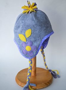 Delia shows how to embellish a simple ear warmer headband with a huge fleece flower.