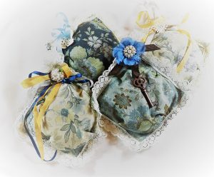 The last picture is the third set of sachets I made with 5” squares, lace, silk ribbon, & some metal vintage ornaments.