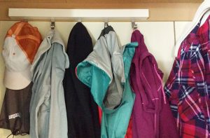 The gray hoodie is on the left & the maroon jacket is on the right.