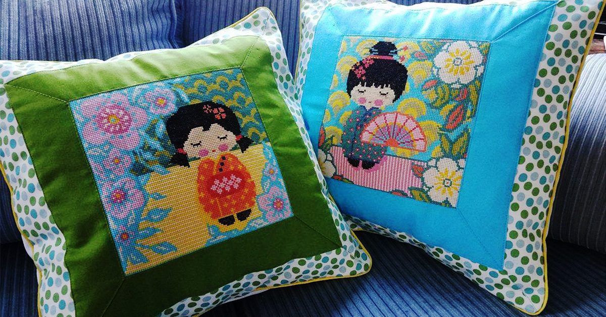 Cross Stitch Panel Pillows with Mitered Fabric Framing