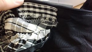 I used the gray gift bag fabric to support the fabric under the rips.