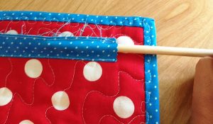 Next up I slid the dowel into the fabric tube & voilà, it fit in just right.