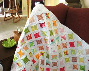 The type of quilt I’m referring to is a cathedral window quilt.