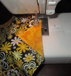 Place the folded edge at the 5/8" mark on your machine, and sew straight across.