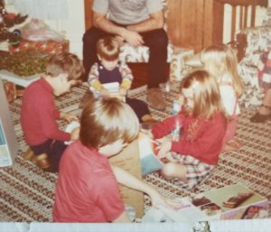 The Christmas Tree Turtleneck. Not a great photo of it but the only one I could find. Note that my brother (sitting across from me) is wearing a turtleneck in the same color.